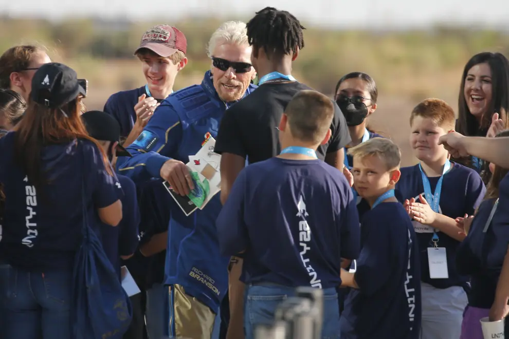 Billionaire entrepreneur Richard Branson departs with his crew prior to boarding at Spaceport America