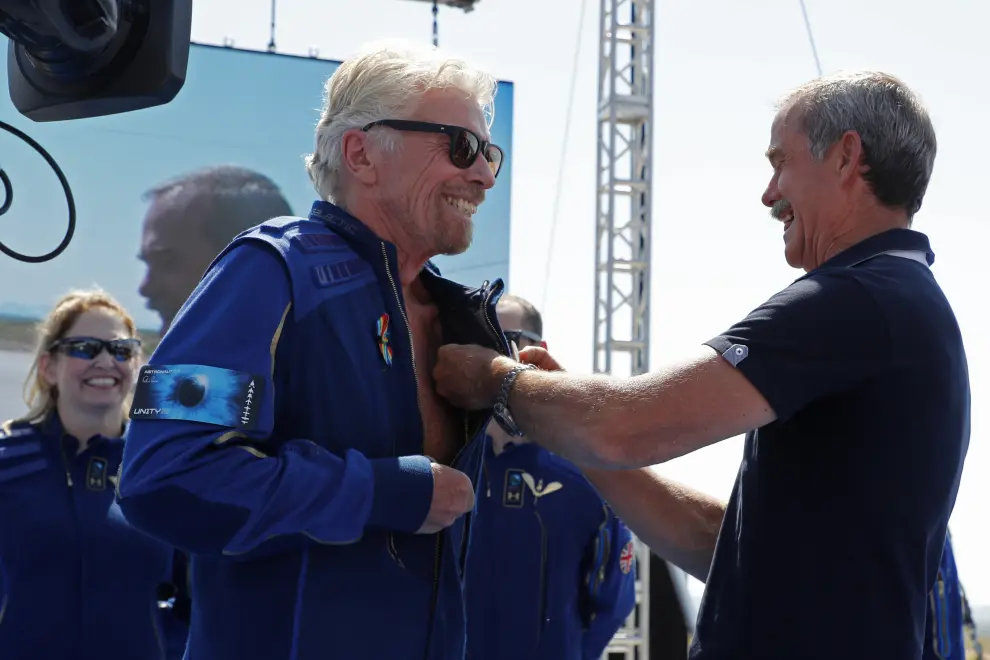 Billionaire entrepreneur Richard Branson is introduced as an astronaut by Canadian astronaut Chris Hadfield at Spaceport America