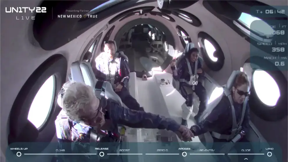 Billionaire Richard Branson congratulates the crew on board Virgin Galactic's passenger rocket plane VSS Unity