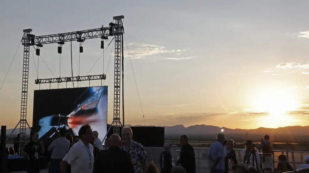 Guests assemble before billionaire entrepreneur Richard Branson departs with his crew for travel to the edge of space at Spaceport America