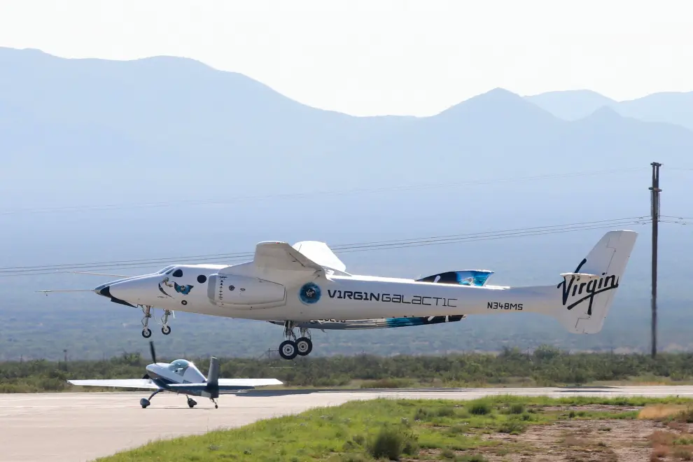 Virgin Galactic's passenger rocket plane VSS Unity takes off with carrier jet at Spaceport America