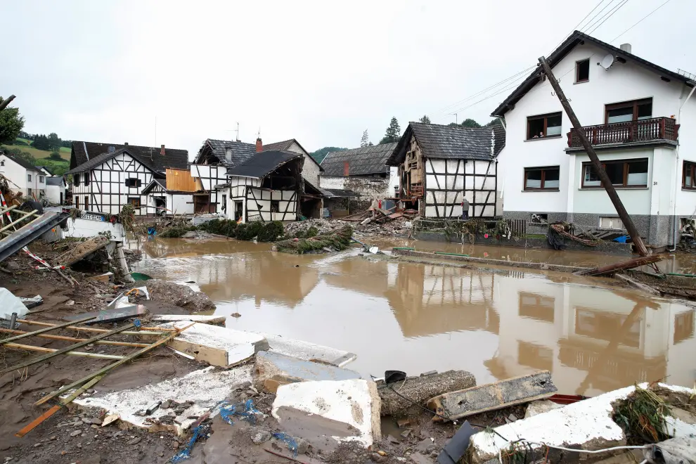 A destroyed car is seen next to the Ahr river, following heavy rainfalls in Schuld, Germany, July 15, 2021. REUTERS/Wolfgang Rattay[[[REUTERS VOCENTO]]] EUROPE-WEATHER/GERMANY