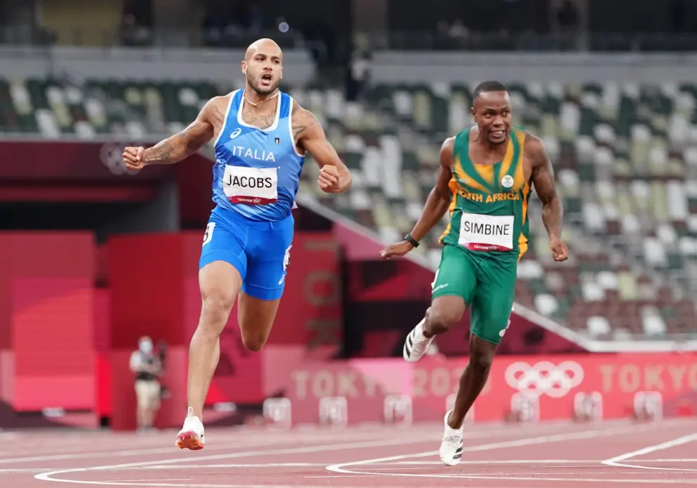 Tokyo 2020 Olympics - Athletics - Mens 100m - Final - OLS - Olympic Stadium, Tokyo, Japan - August 1, 2021. Lamont Marcell Jacobs of Italy crosses the line to win gold REUTERS/Lucy Nicholson[[[REUTERS VOCENTO]]] OLYMPICS-2020-ATH/M-100M-FNL