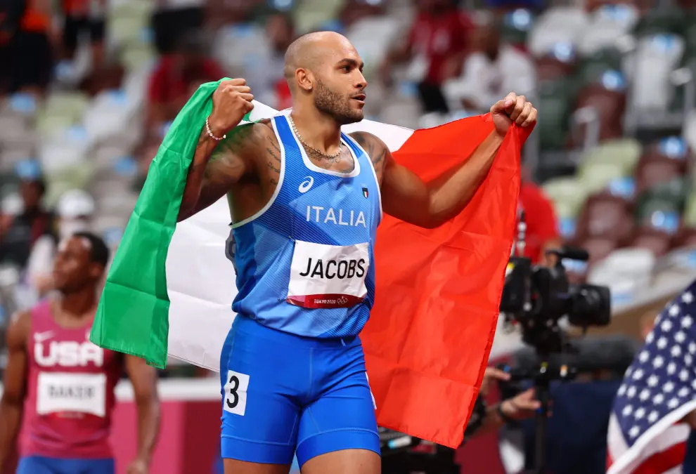 Tokyo 2020 Olympics - Athletics - Mens 100m - Final - OLS - Olympic Stadium, Tokyo, Japan - August 1, 2021. Lamont Marcell Jacobs of Italy celebrates after crosses the line to win gold REUTERS/Lucy Nicholson[[[REUTERS VOCENTO]]] OLYMPICS-2020-ATH/M-100M-FNL