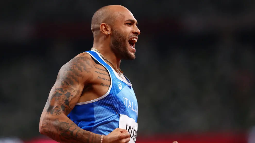 Tokyo 2020 Olympics - Athletics - Mens 100m - Final - OLS - Olympic Stadium, Tokyo, Japan - August 1, 2021. Lamont Marcell Jacobs of Italy celebrates after winning gold REUTERS/Andrew Boyers[[[REUTERS VOCENTO]]] OLYMPICS-2020-ATH/M-100M-FNL