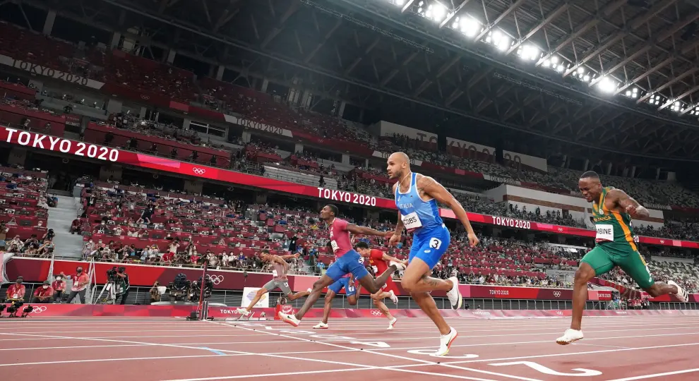 Tokyo 2020 Olympics - Athletics - Mens 100m - Final - OLS - Olympic Stadium, Tokyo, Japan - August 1, 2021. Lamont Marcell Jacobs of Italy crosses the finish line and wins gold REUTERS/Peter Jebautzke[[[REUTERS VOCENTO]]] OLYMPICS-2020-ATH/M-100M-FNL