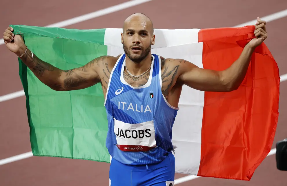 Tokyo 2020 Olympics - Athletics - Mens 100m - Final - OLS - Olympic Stadium, Tokyo, Japan - August 1, 2021. Lamont Marcell Jacobs of Italy celebrates after winning gold REUTERS/Phil Noble[[[REUTERS VOCENTO]]] OLYMPICS-2020-ATH/M-100M-FNL