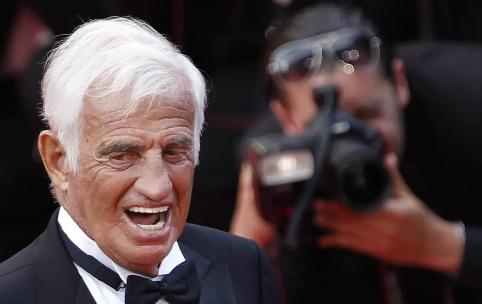 FILE PHOTO: Actor Jean-Paul Belmondo smiles after he received a Palme award prior to the screening of a documentary on his career at the 64th Cannes Film Festival, May 17, 2011.  REUTERS/Eric Gaillard/File Photo[[[REUTERS VOCENTO]]] PEOPLE-BELMONDO/
