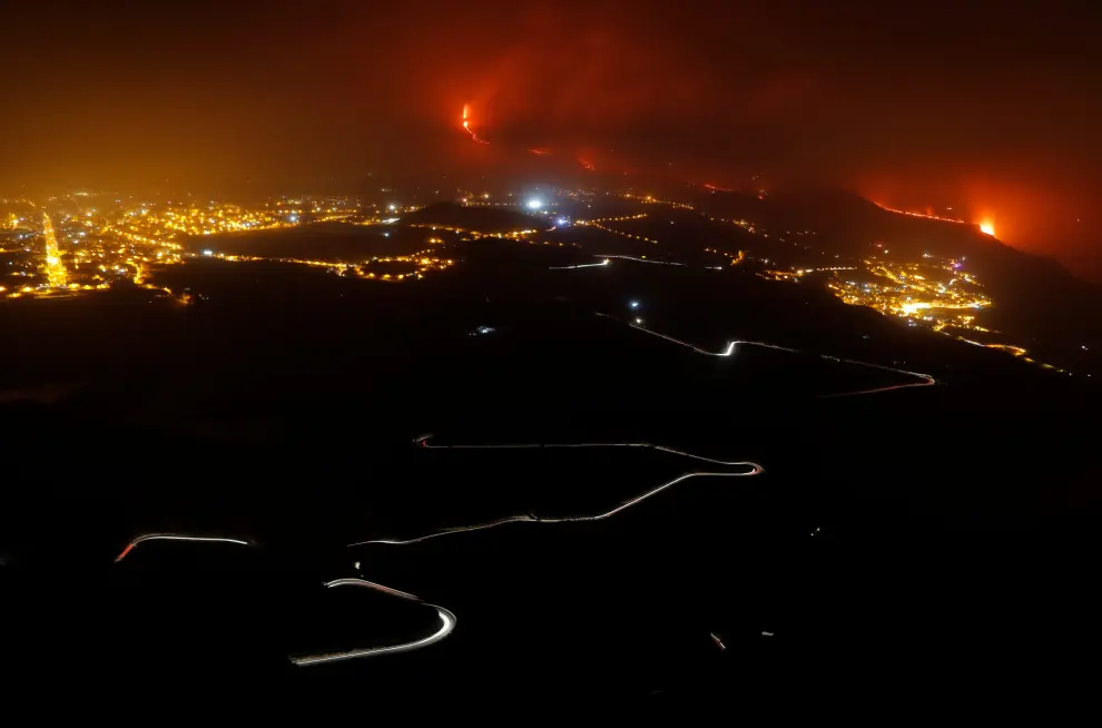 Lava flows into the sea, as seen from Tijarafe, following the eruption of a volcano on the Canary Island of La Palma, Spain, September 28, 2021. REUTERS/Borja Suarez[[[REUTERS VOCENTO]]] SPAIN-VOLCANO/