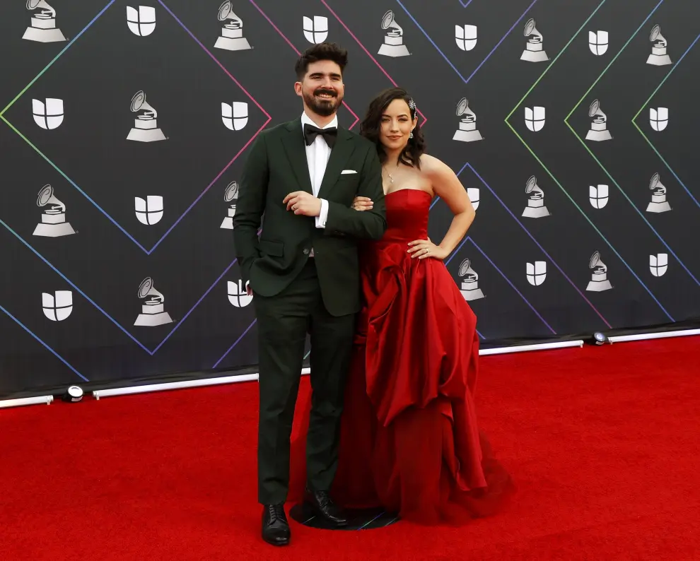 Las Vegas (United States), 18/11/2021.- Luis Sandoval (R) and Renato Perez kiss on the red carpet for the 22nd annual Latin Grammy Awards ceremony at the MGM Grand Garden Arena in Las Vegas, Nevada, USA, 18 November 2021. The Latin Grammys recognize artistic and/or technical achievement, not sales figures or chart positions, and the winners are determined by the votes of their peers - the qualified voting members of the Latin Recording Academy. (Estados Unidos) EFE/EPA/NINA PROMMER
 USA LATIN GRAMMYS 2021