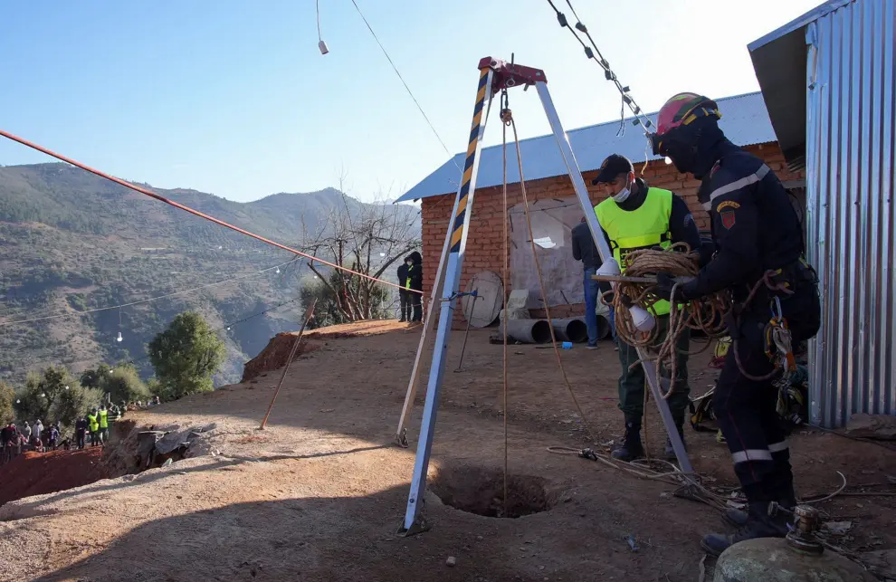Rescuers stand near the whole of a well into which a five-year-old boy fell in the northern hill town of Chefchaouen, Morocco February 5, 2022. REUTERS/Thami Nouas   NO RESALES. NO ARCHIVES. BEST QUALITY AVAILABLE. MOROCCO-WELL/