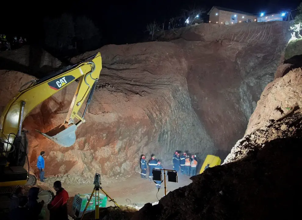 Rescuers stand near the hole of a well into which a five-year-old boy fell in the northern hill town of Chefchaouen, Morocco February 5, 2022. REUTERS/Thami Nouas NO RESALES. NO ARCHIVES. BEST QUALITY AVAILABLE. MOROCCO-WELL/