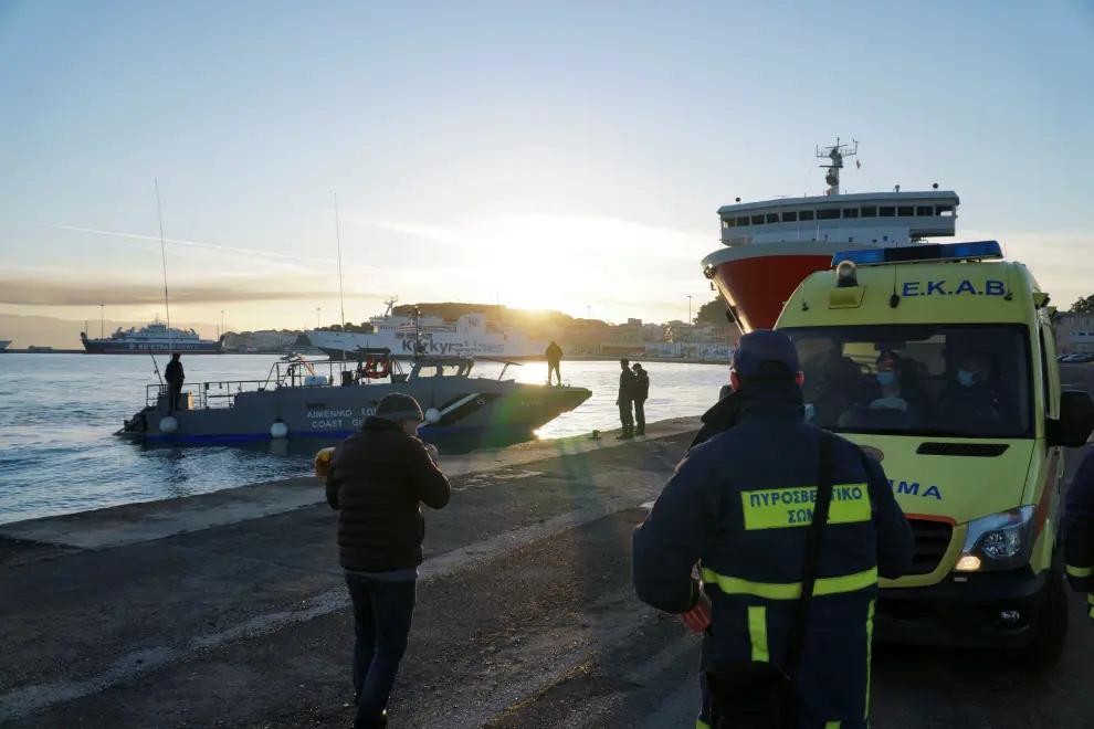 A passenger from Italian-flagged Euroferry Olympia disembarks from a Greek coast guard vessel at the port of Corfu, after being rescued from the ship that caught fire off the island of Corfu, Greece, February 18, 2022. Stamatis Katapodis/Eurokinissi via REUTERS ATTENTION EDITORS - THIS IMAGE WAS PROVIDED BY A THIRD PARTY. NO RESALES. NO ARCHIVE. GREECE OUT. NO COMMERCIAL OR EDITORIAL SALES IN GREECE. GREECE-FERRY/FIRE