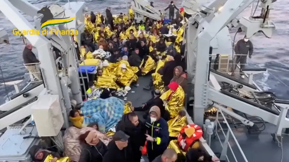 Passengers from the Italian-flagged Grimaldi Euroferry Olympia, that caught fire off the island of Corfu, are seen on board of the Guardia di Finanza vessel after being rescued, Greece, February 18, 2022. In this screengrab taken from video. Guardia di Finanza Press Office/Handout via REUTERS ATTENTION EDITORS - THIS IMAGE HAS BEEN SUPPLIED BY A THIRD PARTY. NO RESALES. NO ARCHIVES GREECE-FERRY/FIRE