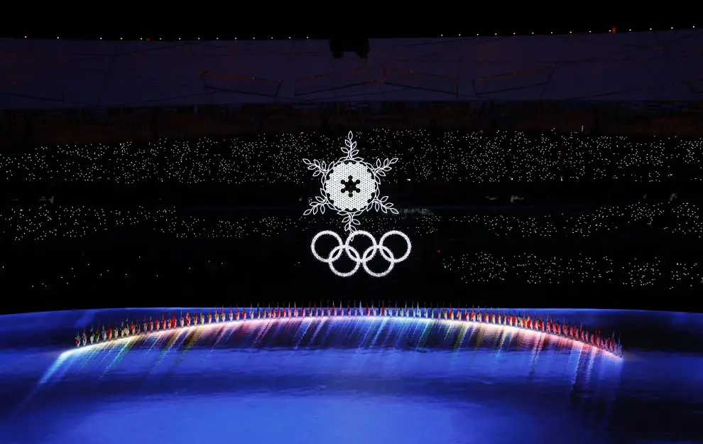 2022 Beijing Olympics - Closing Ceremony - National Stadium, Beijing, China - February 20, 2022. A snowflake and national flags are seen during the closing ceremony. REUTERS/David W Cerny OLYMPICS-2022-CLOSING/