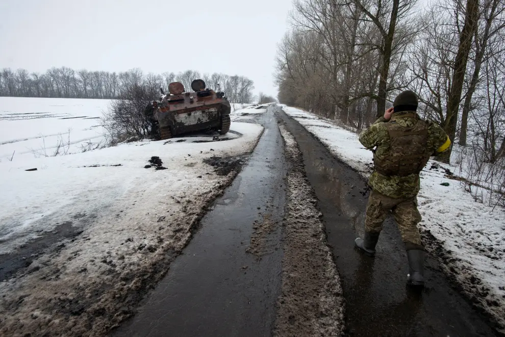 A Ukrainian serviceman stands at a captured Russian tank, amid the Russian invasion of Ukraine, in the north of the Kharkiv region, Ukraine March 2, 2022. Picture taken March 2, 2022. Irina Rybakova/Press service of the Ukrainian Ground Forces/Handout via REUTERS THIS IMAGE HAS BEEN SUPPLIED BY A THIRD PARTY. MANDATORY CREDIT UKRAINE-CRISIS/KHARKIV