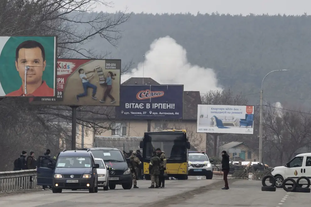 A man waits inside a bus as he escapes from the town of Irpin, after heavy shelling on the only escape route used by locals, while Russian troops advance towards the capital, in Irpin, near Kyiv, Ukraine March 6, 2022. REUTERS/Carlos Barria UKRAINE-CRISIS/IRPIN