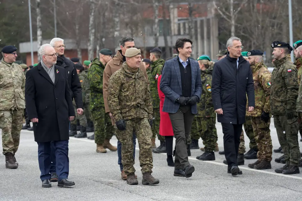 Spanish Prime Minister Pedro Sanchez arrives with Canadian Prime Minister Justin Trudeau and NATO Secretary-General Jens Stoltenberg in Adazi, Latvia, March 8, 2022. REUTERS/Ints Kalnins UKRAINE-CRISIS/TRUDEAU-LATVIA