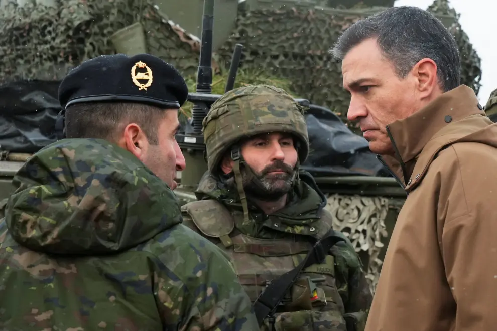 Spanish Prime Minister Pedro Sanchez and NATO Secretary-General Jens Stoltenberg visit members of the military, following the Russian invasion of Ukraine, in the Adazi military base, Latvia, March 8, 2022. REUTERS/Ints Kalnins UKRAINE-CRISIS/TRUDEAU-LATVIA