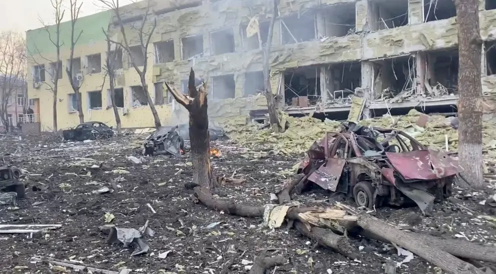 A car burns after the destruction of Mariupol children's hospital as Russia's invasion of Ukraine continues, in Mariupol, Ukraine, March 9, 2022 in this still image from a handout video obtained by Reuters. Ukraine Military/Handout via REUTERS    THIS IMAGE HAS BEEN SUPPLIED BY A THIRD PARTY. UKRAINE-CRISIS/MARIUPOL