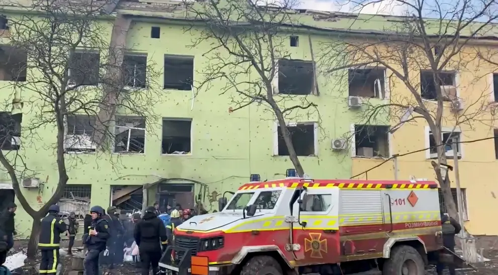A person is carried out after the destruction of Mariupol children's hospital as Russia's invasion of Ukraine continues, in Mariupol, Ukraine, March 9, 2022 in this still image from a handout video obtained by Reuters. Ukraine Military/Handout via REUTERS    THIS IMAGE HAS BEEN SUPPLIED BY A THIRD PARTY. UKRAINE-CRISIS/MARIUPOL