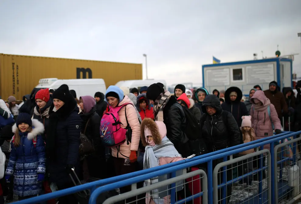 People arrive by ferry after fleeing from Russia's invasion of Ukraine, at the Isaccea-Orlivka border crossing, Romania, March 11, 2022. REUTERS/Stoyan Nenov UKRAINE-CRISIS/BORDER-ROMANIA