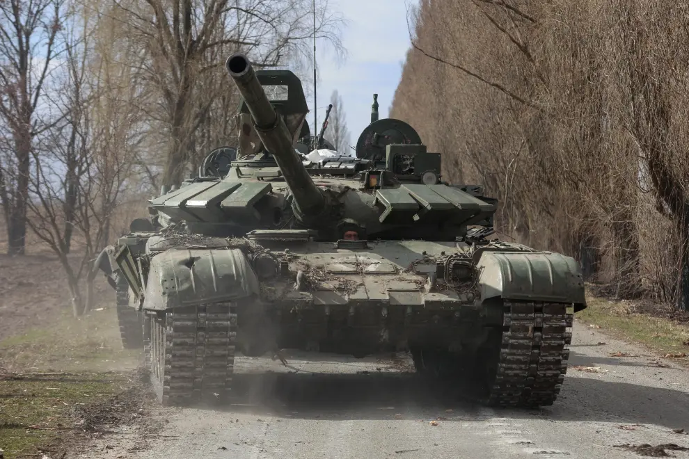 A Ukrainian service member drives a captured Russian T-72 tank, as Russia's attack on Ukraine continues, in the recently liberated village of Lukianivka, in Kyiv region, Ukraine March 27, 2022. REUTERS/Serhii Nuzhnenko UKRAINE-CRISIS/RUSSIA-EXPORTS