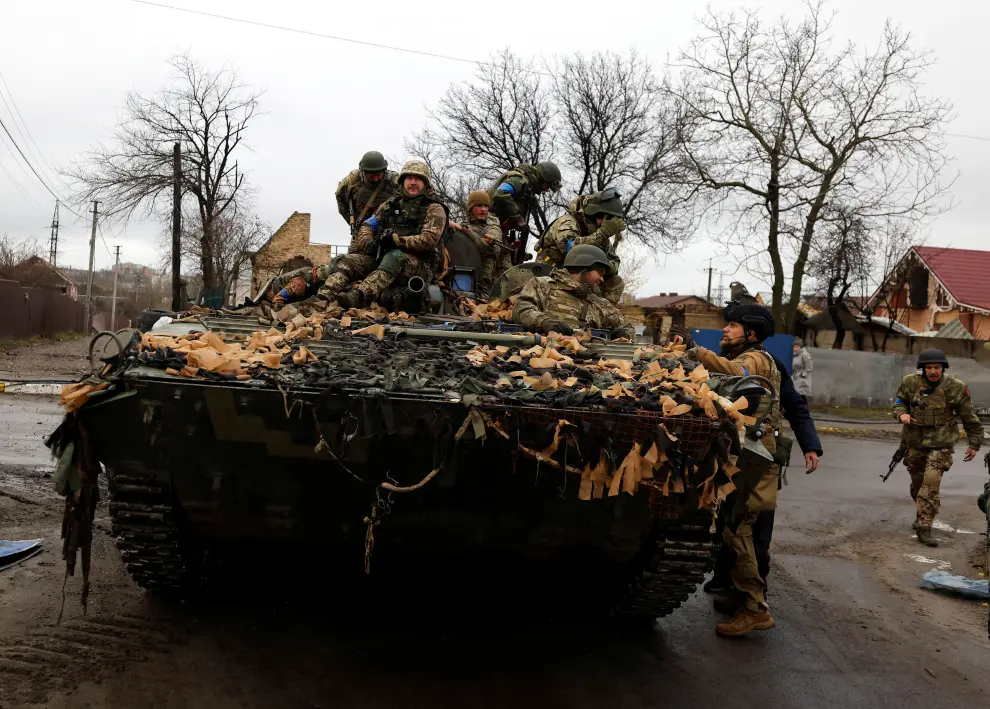 Ukrainian soldiers are pictured in their military vehicle, amid Russia's invasion on Ukraine in Bucha, in Kyiv region