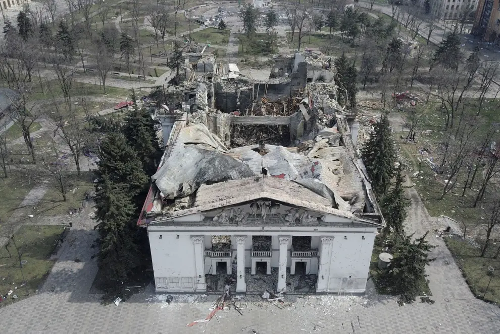 A view shows the building of a theatre destroyed in the course of Ukraine-Russia conflict, as a word "children" in Russian is written in large white letters on the pavement, in the southern port city of Mariupol, Ukraine April 10, 2022.  Picture taken with a drone. REUTERS/Pavel Klimov UKRAINE-CRISIS/MARIUPOL