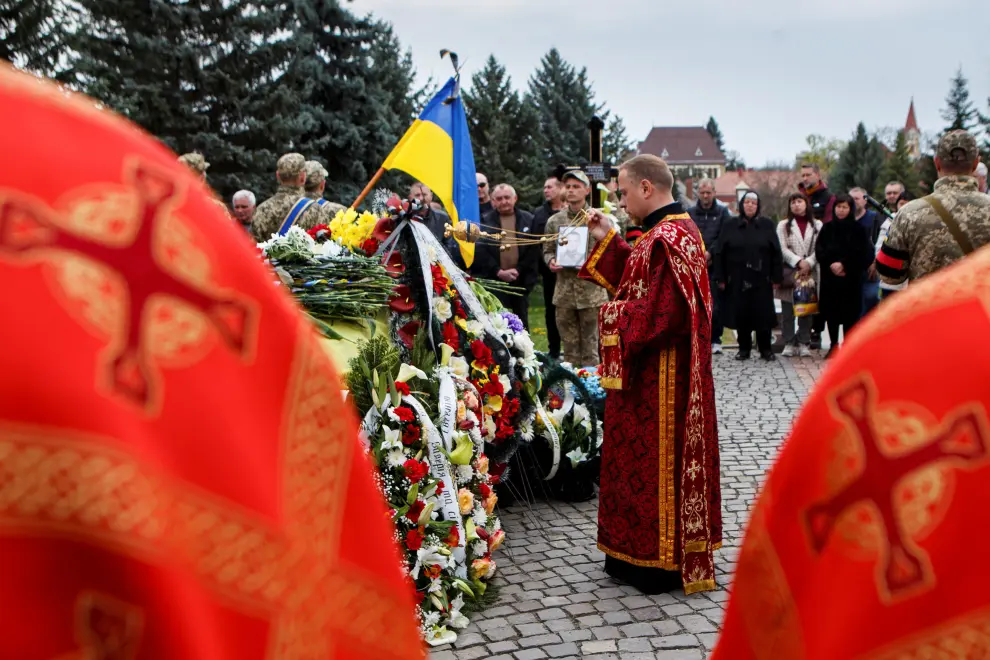 Greek Catholic Bishop Neil holds the funeral of Yevhen Kuklyshyn, who died during Russia's invasion of Ukraine, in Uzhhorod, Ukraine, April 22, 2022. REUTERS/Serhii Hudak UKRAINE-CRISIS/