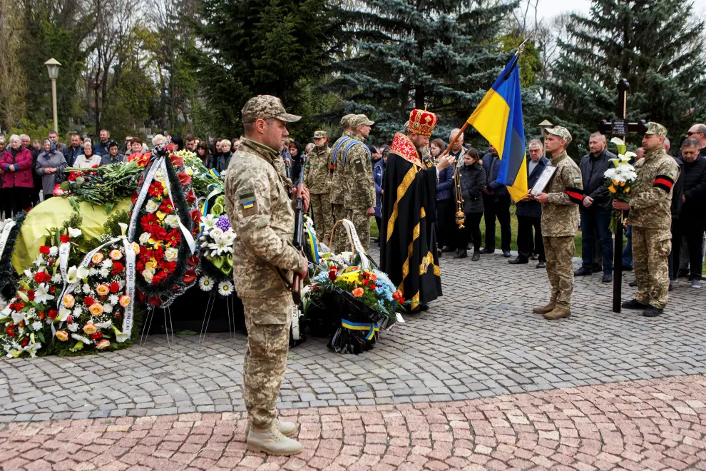 People attend the funeral of Yevhen Kuklyshyn, who died during Russia's invasion of Ukraine, in Uzhhorod, Ukraine, April 22, 2022. REUTERS/Serhii Hudak UKRAINE-CRISIS/