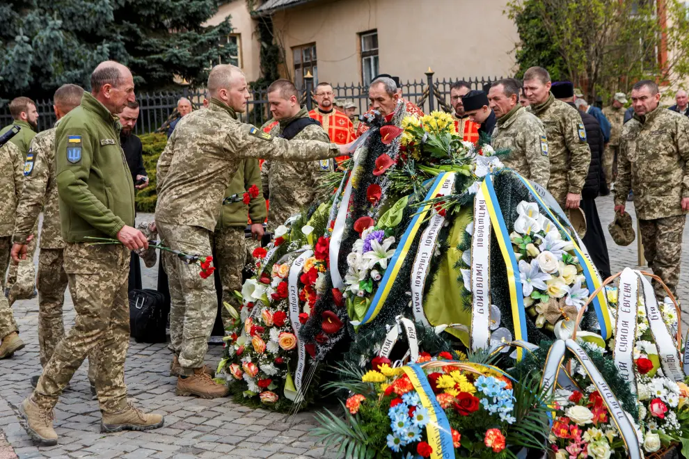 People attend the funeral of Yevhen Kuklyshyn, who died during Russia's invasion of Ukraine, in Uzhhorod, Ukraine, April 22, 2022. REUTERS/Serhii Hudak UKRAINE-CRISIS/