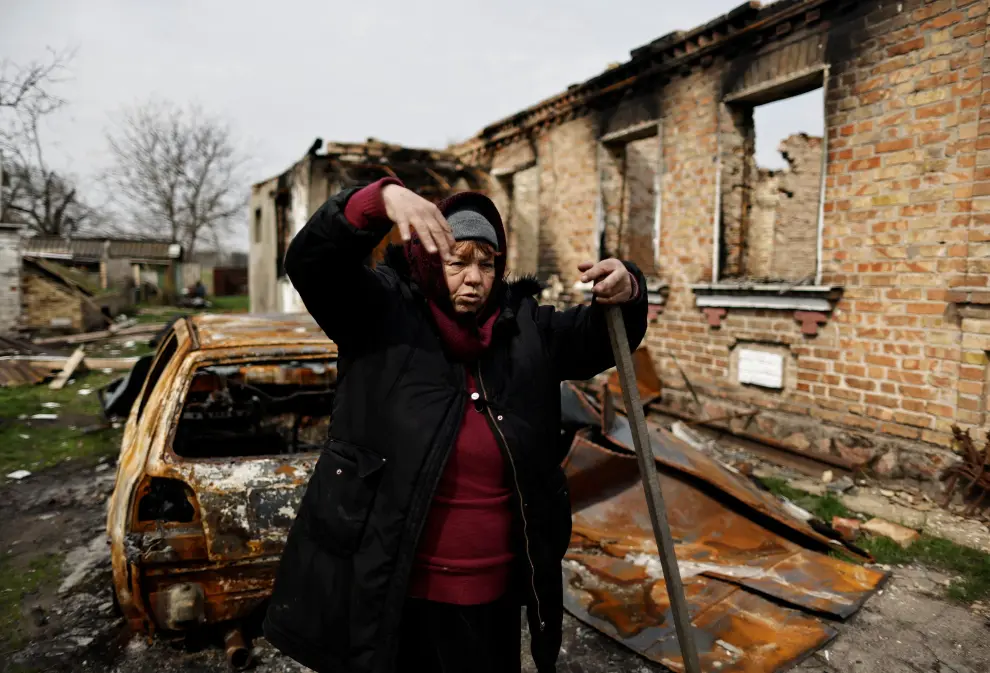 Ludmila Sadlova, 72, stands by her house, that according to her was hit by rockets on March 12, amid Russia's invasion of Ukraine, in Ozera, Kyiv region, Ukraine April 23, 2022. REUTERS/Zohra Bensemra UKRAINE-CRISIS/