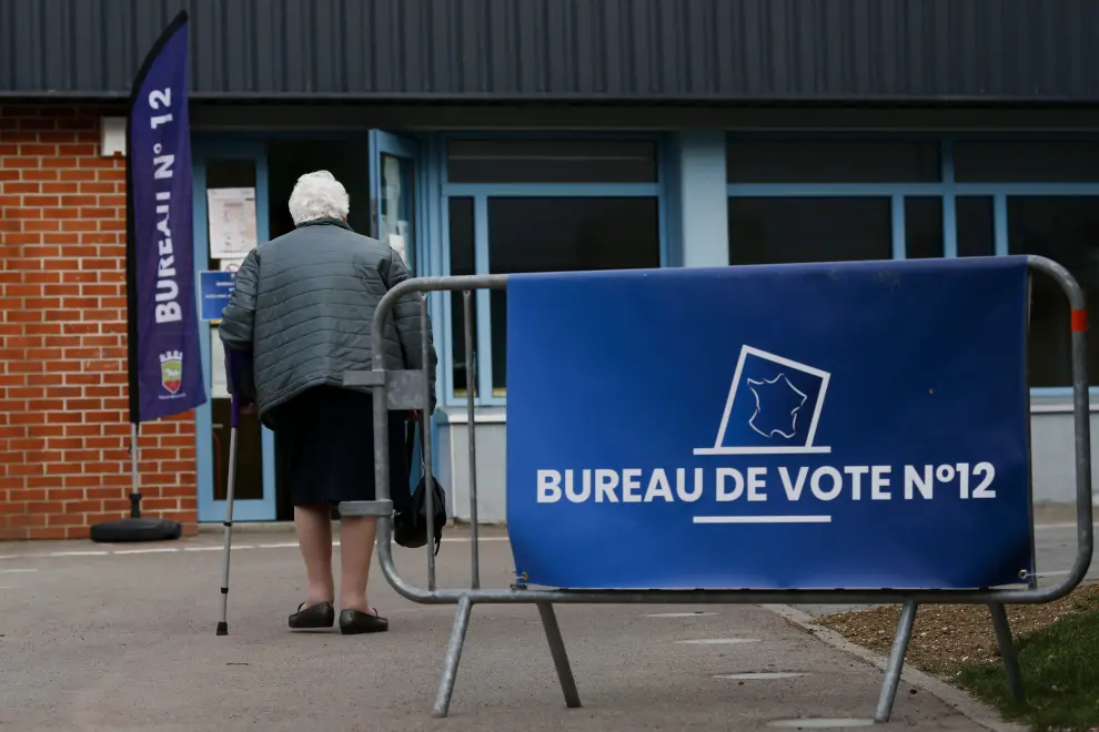 A sign is seen at a polling station in the second round of the 2022 French presidential election in Paris, France, April 24, 2022. REUTERS/Piroschka Van De Wouw FRANCE-ELECTION/