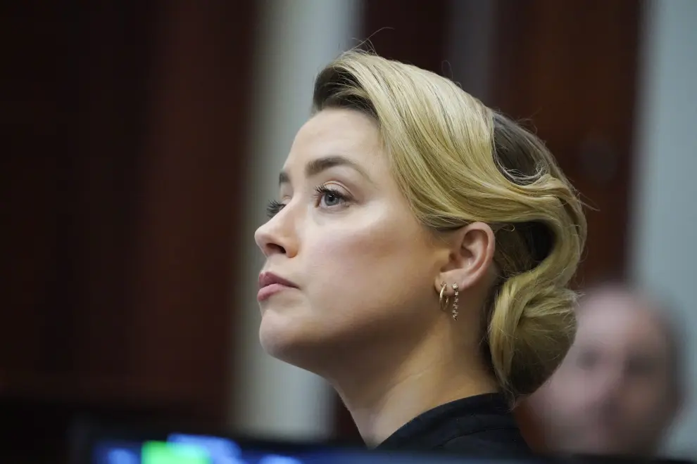 Actor Johnny Depp looks on as he testifies in the courtroom during the defamation trial against ex-wife Amber Heard at the Fairfax County Circuit Courthouse in Fairfax, Virginia, U.S., April 25, 2022. Steve Helber/Pool via REUTERS PEOPLE-DEPP/