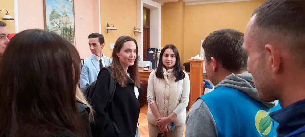 U.S. actor and UNHCR Special Envoy Angelina Jolie poses with Andriy Galickiy, founder of Lviv Croissants, during her visit to Lviv, amid Russia's invasion of Ukraine April 30, 2022 in this handout image. Andriy Galickiy/Handout via REUTERS ATTENTION EDITORS - THIS IMAGE HAS BEEN PROVIDED BY A THIRD PARTY. MANDATORY CREDIT. NO RESALES. NO ARCHIVES. THIS PICTURE WAS PROCESSED BY REUTERS TO ENHANCE QUALITY. AN UNPROCESSED VERSION HAS BEEN PROVIDED SEPARATELY. UKRAINE-CRISIS/LVIV-JOLIE