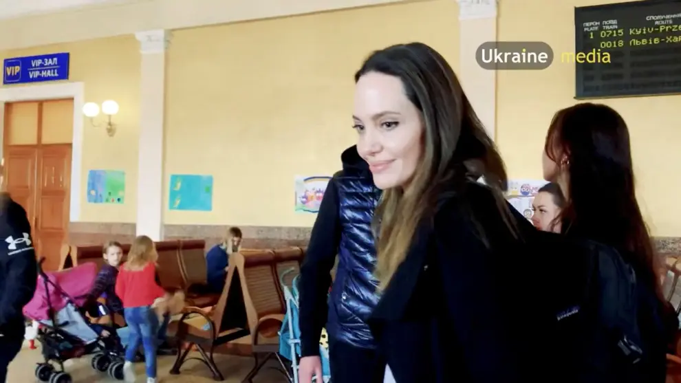 U.S. actor and UNHCR Special Envoy Angelina Jolie poses for a picture with people at the main railway station during her visit to Lviv, amid Russia's ongoing invasion of Ukraine, in Lviv, Ukraine April 30, 2022 in this still image obtained from a social media video. Video recorded April 30, 2022. Lviv.Media via REUTERS ATTENTION EDITORS - THIS IMAGE HAS BEEN PROVIDED BY A THIRD PARTY. MANDATORY CREDIT. NO RESALES. NO ARCHIVES. UKRAINE-CRISIS/LVIV-JOLIE