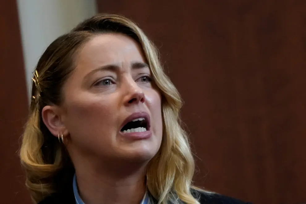 Actor Amber Heard testifies about the first time she says her ex-husband, actor Johnny Depp hit her, at Fairfax County Circuit Court during a defamation case against her by Depp in Fairfax, Virginia, U.S., May 4, 2022. REUTERS/Elizabeth Frantz/Pool PEOPLE-DEPP/
