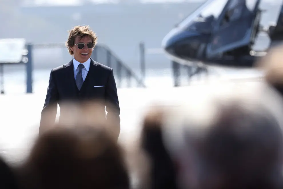 Cast member Tom Cruise waves as he arrives at the global premiere for the film Top Gun: Maverick on the USS Midway Museum in San Diego, California, U.S., May 4, 2022. REUTERS/Mario Anzuoni FILM-TOP GUN MAVERICK/
