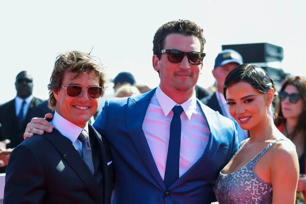 Cast members Miles Teller, Jennifer Connelly and Tom Cruise attend the global premiere for the film Top Gun: Maverick on the USS Midway Museum in San Diego, California, U.S., May 4, 2022. REUTERS/Mario Anzuoni FILM-TOP GUN MAVERICK/
