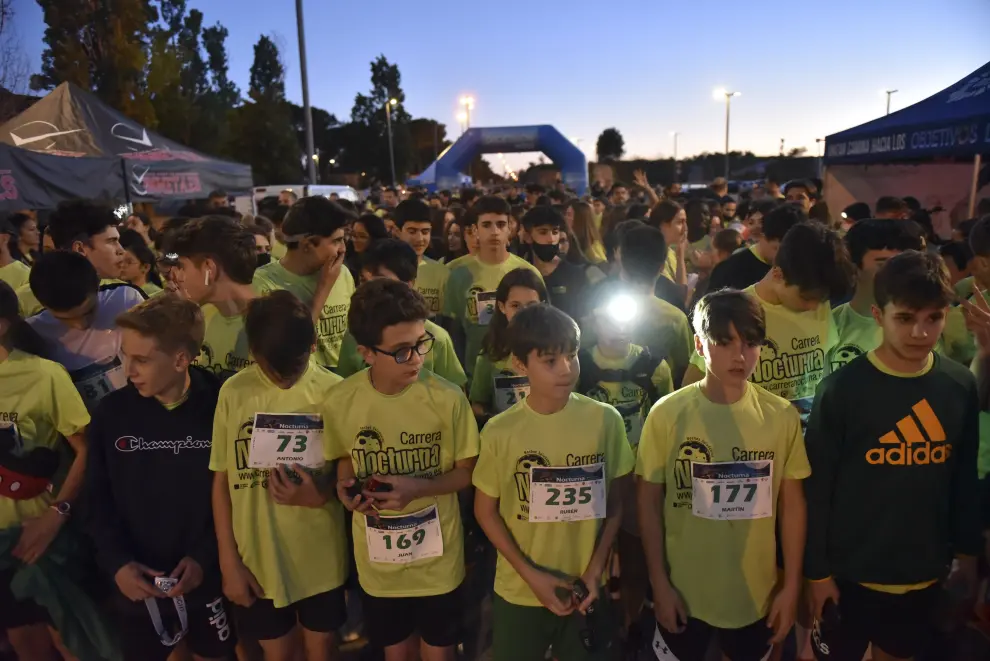 La carrera nocturna de Huesca reúne a más de 600 ‘iluminados’