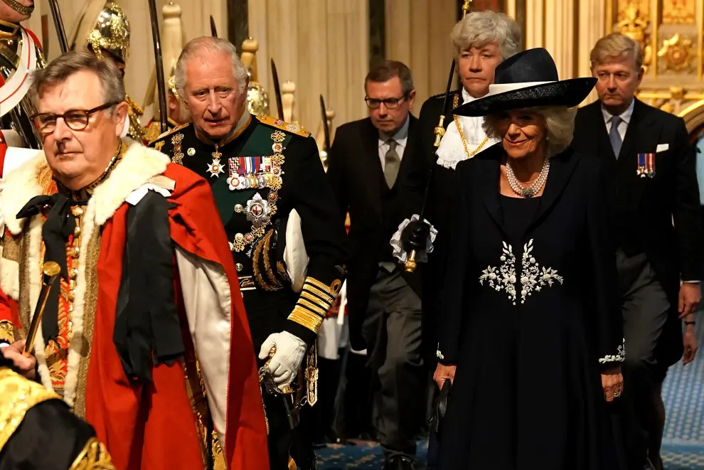 Britain's Prince Charles, Camilla, Duchess of Cornwall, and Prince William proceed behind the Imperial State Crown through the Royal Gallery for the State Opening of Parliament at the Palace of Westminster in London, Britain, May 10, 2022. REUTERS/Hannah McKay/Pool BRITAIN-POLITICS/PARLIAMENT