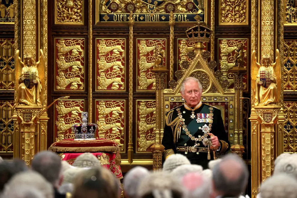 Britain's Prince Charles appears on a screen next to a painting of Queen Elizabeth at the Royal Gallery as he delivers the Queen's Speech during the State Opening of Parliament at the Palace of Westminster in London, Britain, May 10, 2022. REUTERS/Hannah McKay/Pool BRITAIN-POLITICS/PARLIAMENT