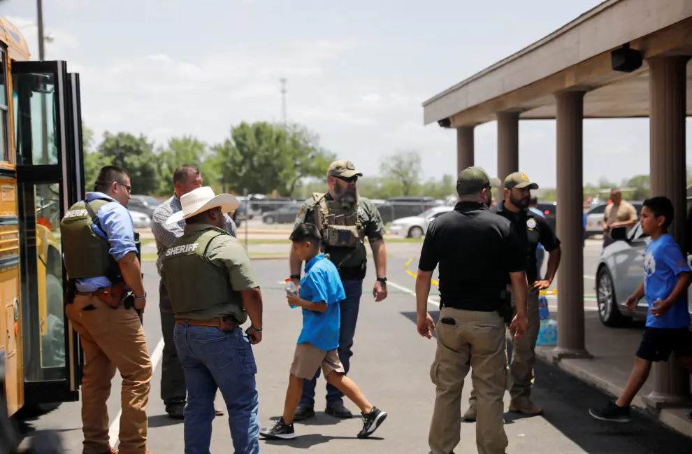 Law enforcement personnel guard the scene of a suspected shooting near Robb Elementary School in Uvalde, Texas, U.S. May 24, 2022.  REUTERS/Marco Bello TEXAS-SHOOTING/
