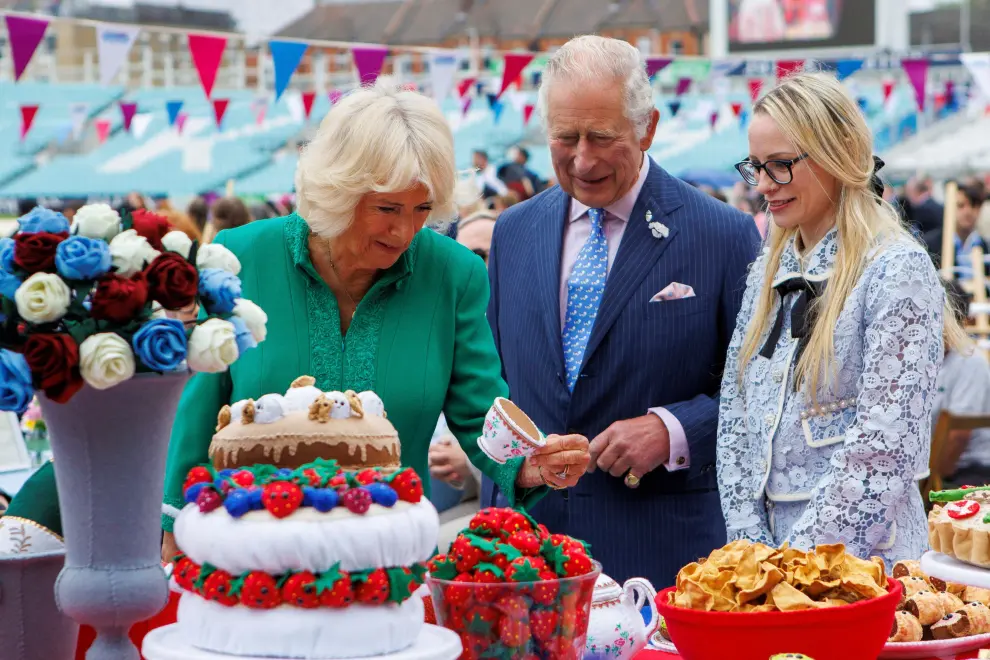 Britain's Prince Charles and his wife Camilla, Duchess of Cornwall, look at decorations at The Oval cricket ground as they attend a Big Jubilee Lunch amid celebrations marking the Platinum Jubilee of Britain's Queen Elizabeth, in London, Britain, June 5, 2022. Jamie Lorriman/Pool via REUTERS BRITAIN-ROYALS/PLATINUM-JUBILEE-OVAL