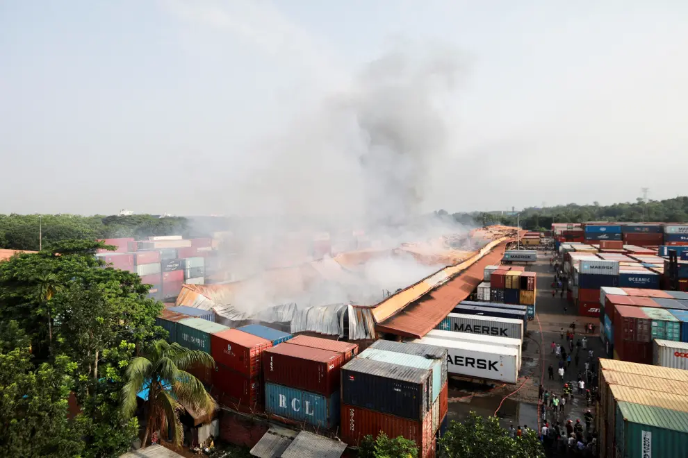 Smoke rises from the spot after a massive fire broke out in an inland container depot at Sitakunda, near the port city Chittagong