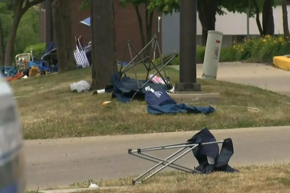 A child's stroller with a stars and stripes balloon attached is left after gunfire erupted at a Fourth of July parade route in the wealthy Chicago suburb of Highland Park, Illinois, U.S. July 4, 2022 in a still image from video. ABC affiliate WLS/ABC7 via REUTERS     NO RESALES. NO ARCHIVES. MANDATORY CREDIT USA-JULYFOURTH/SHOOTING
