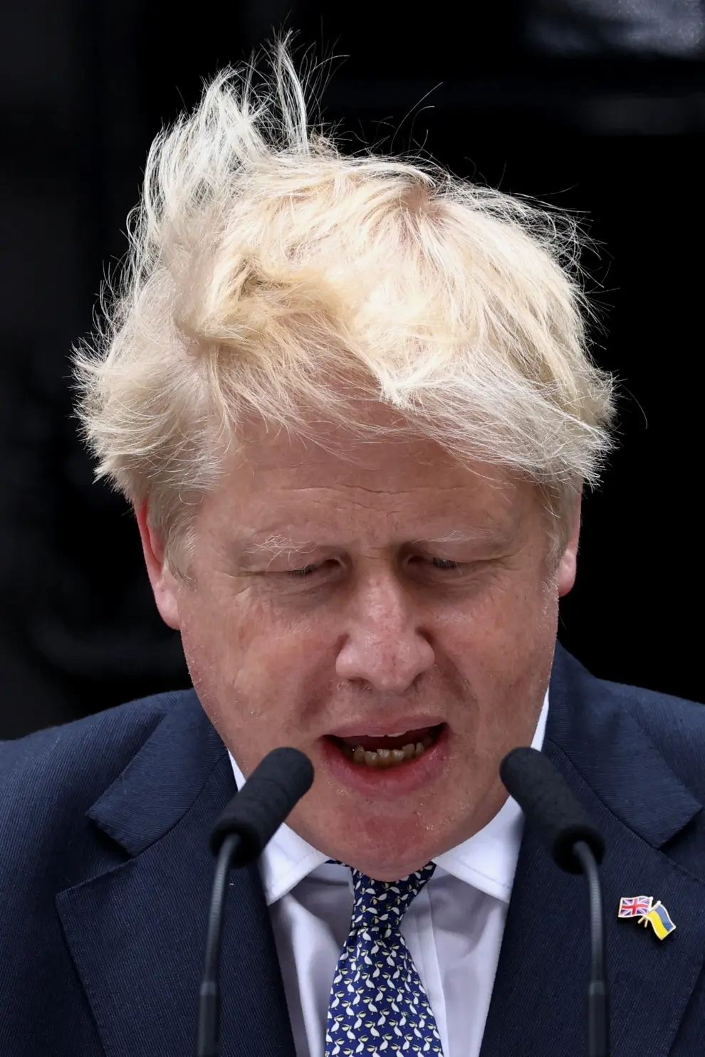 People listen as British Prime Minister Boris Johnson makes a statement at Downing Street in London, Britain, July 7, 2022. REUTERS/Maja Smiejkowska BRITAIN-POLITICS/