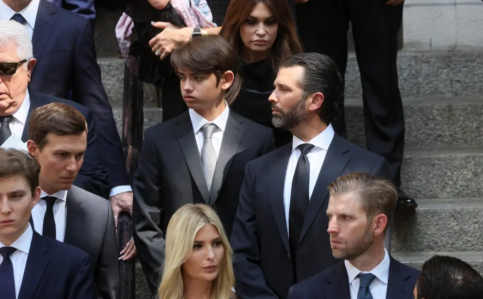 Former U.S. President Donald Trump, his wife Melania, his sons Barron and Eric, his daughter Ivanka, her husband Jared Kushner and his granddaughter Kai Madison leave St. Vincent Ferrer Church during the funeral of Ivana Trump, socialite and Trump's first wife, in New York City, U.S., July 20, 2022.  REUTERS/Brendan McDermid PEOPLE-IVANA TRUMP/FUNERAL