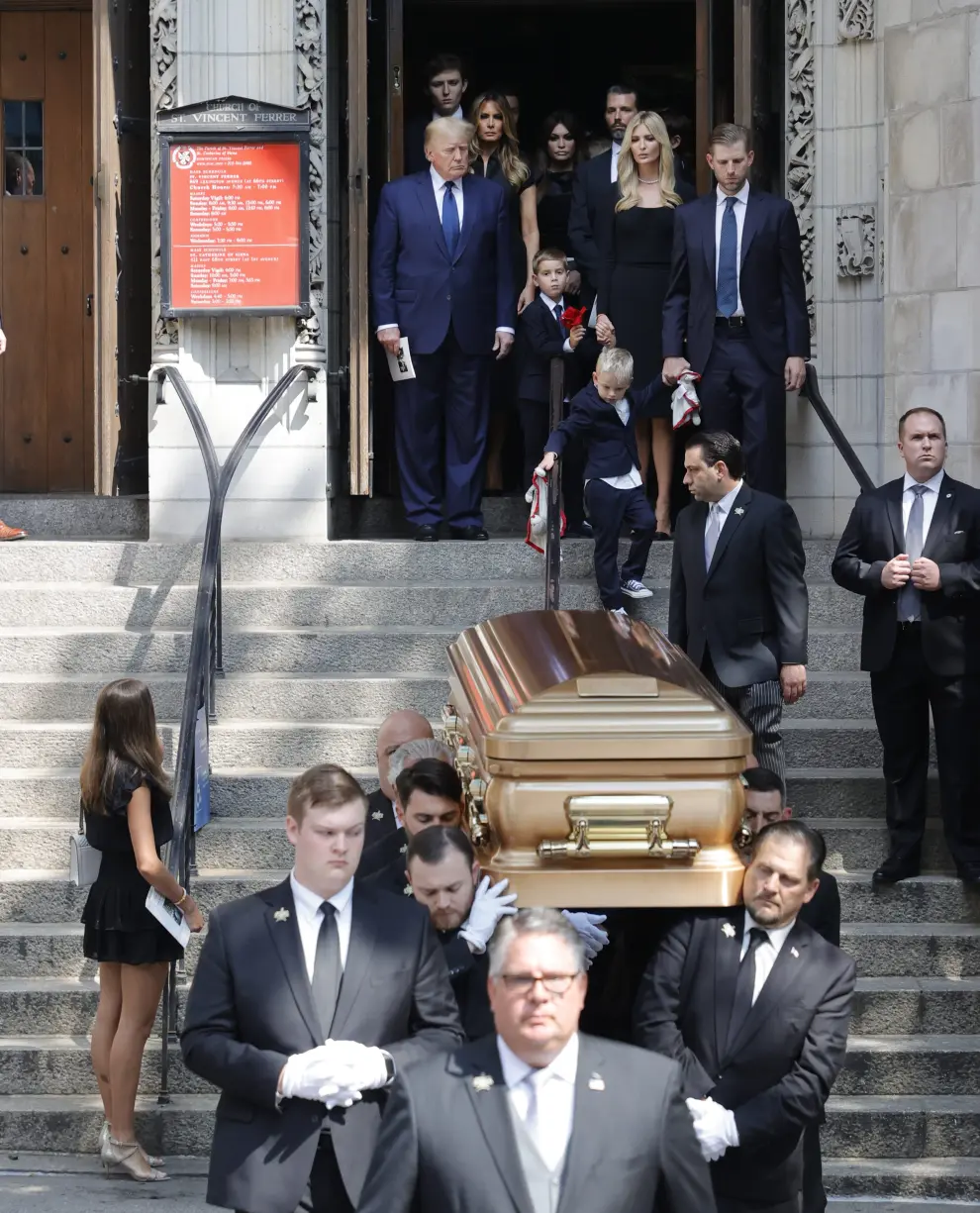 Former U.S. President Donald Trump, his wife Melania, Kimberly Guilfoyle, his sons Barron and Donald Jr. and his daughter Ivanka leave St. Vincent Ferrer Church during the funeral of Ivana Trump, socialite and Trump's first wife, in New York City, U.S., July 20, 2022.  REUTERS/Brendan McDermid PEOPLE-IVANA TRUMP/FUNERAL